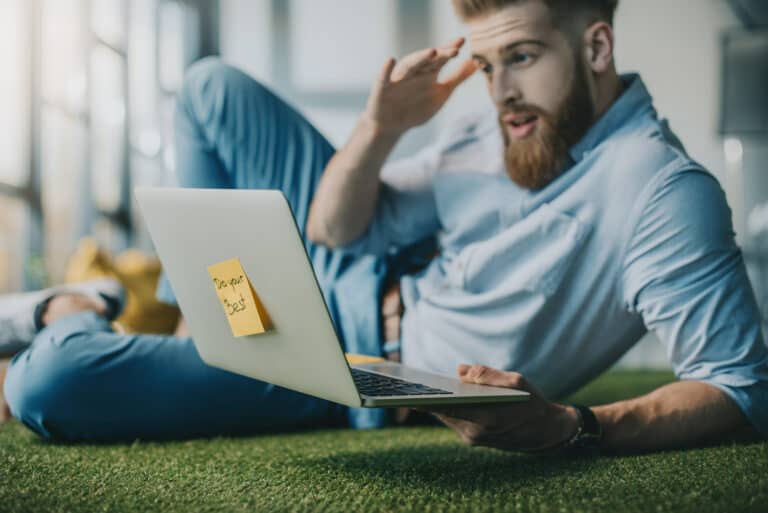 Man using laptop. Shocked / surprised.