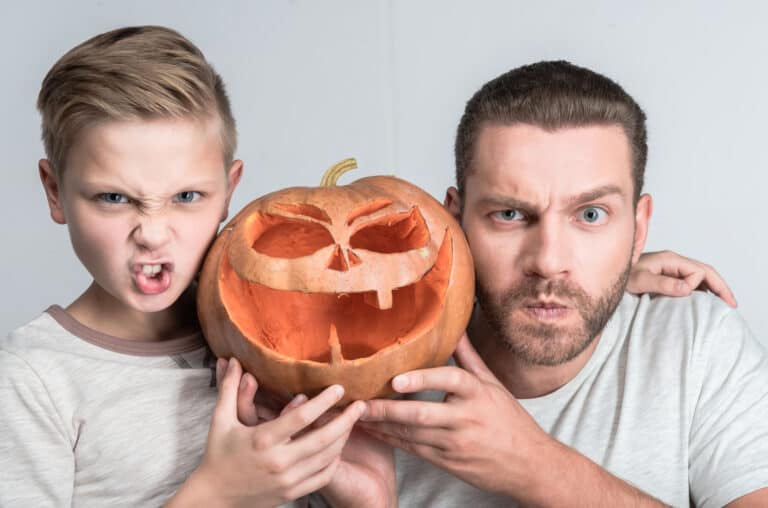 Father and son with halloween pumpkin