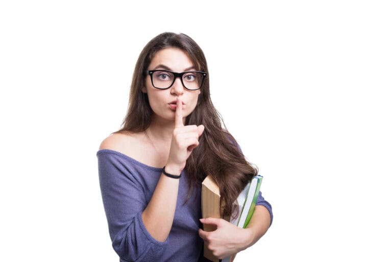 Young beautiful brunette student requires silence