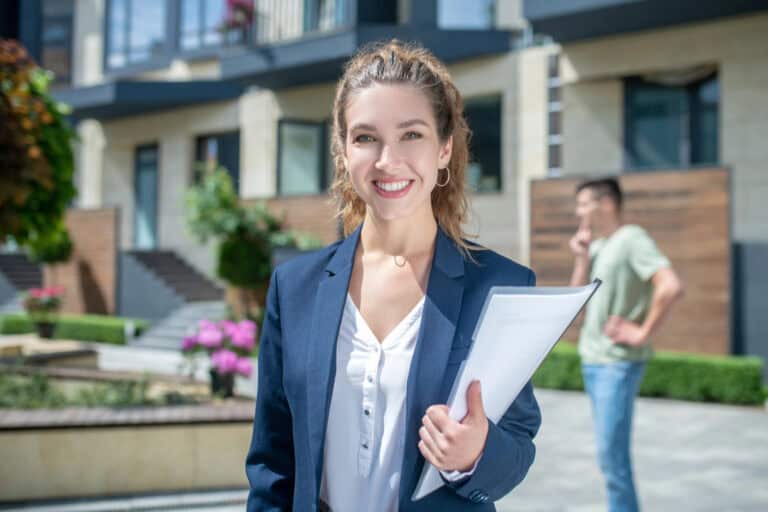 Cute businesswoman in an official outfit smiling nicely