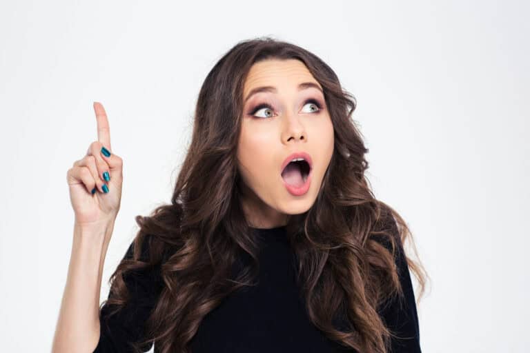 Portrait of a woman pointing finger up