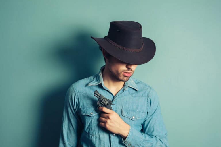 Young cowboy with revolver