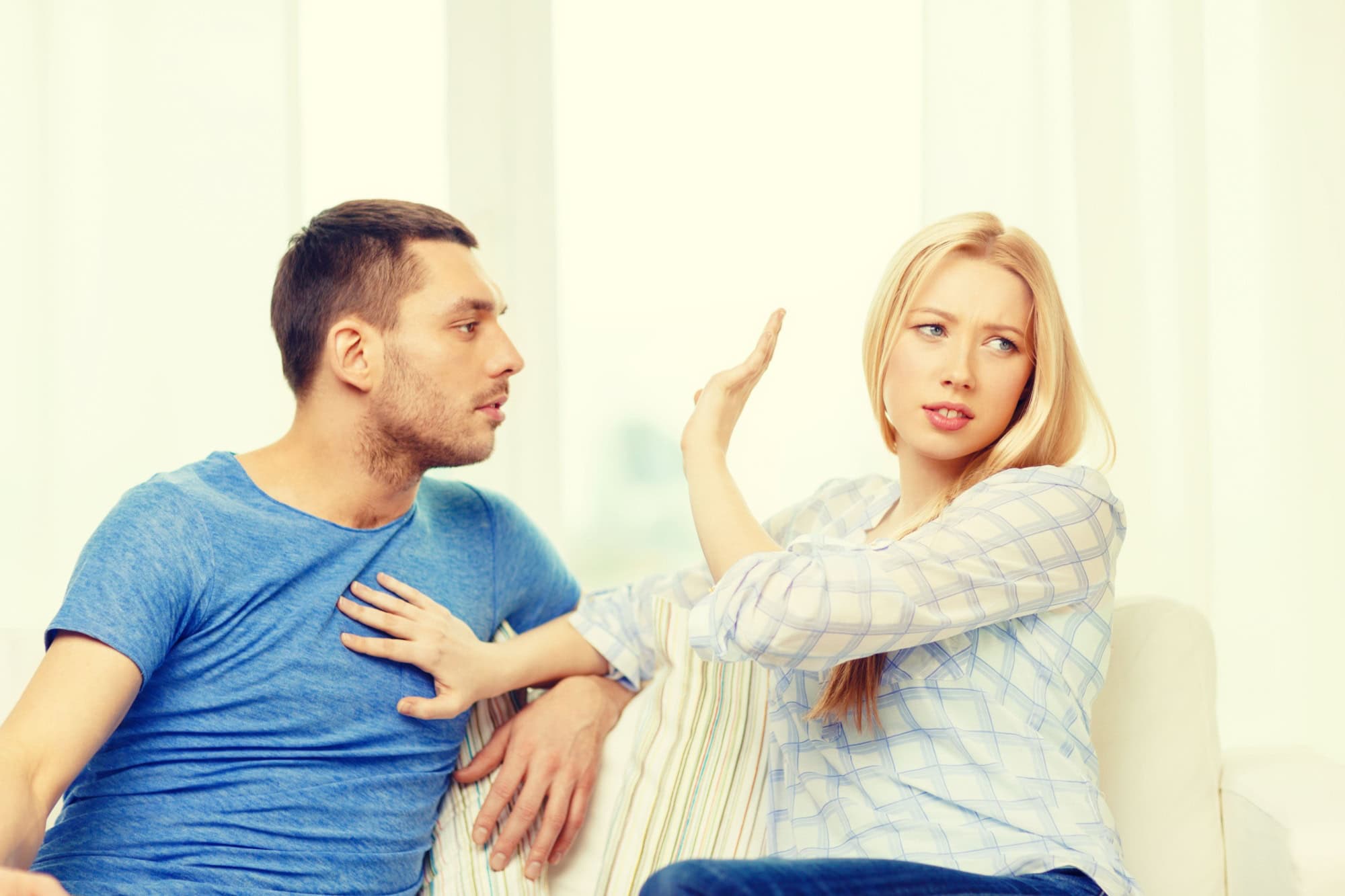 love, family and happiness concept - unhappy couple having argument at home
