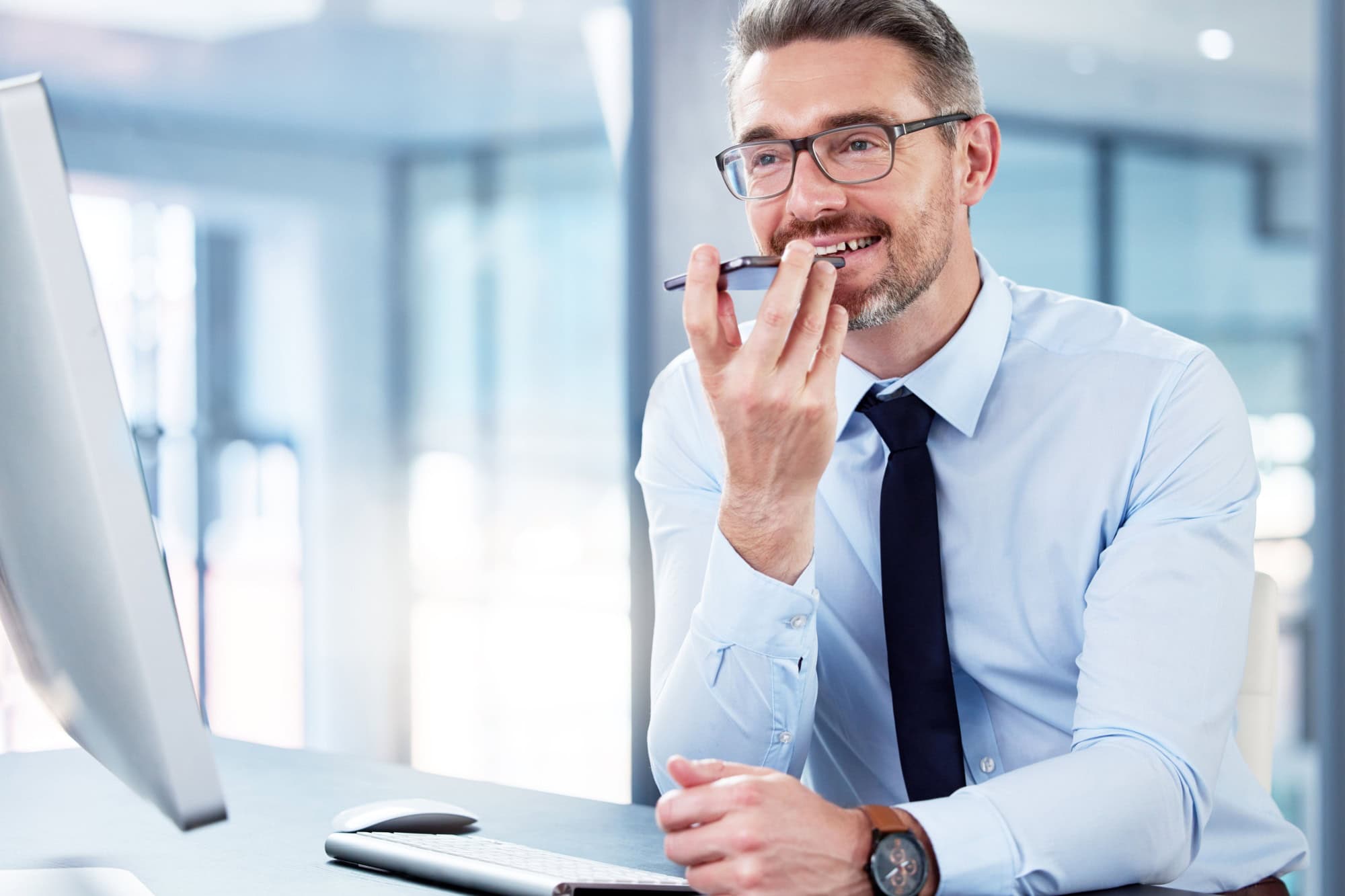 Business, man and phone call with loudspeaker, communication and network with planning. Person, employee and consultant with smartphone, recording voice note and speaking with digital app and talking