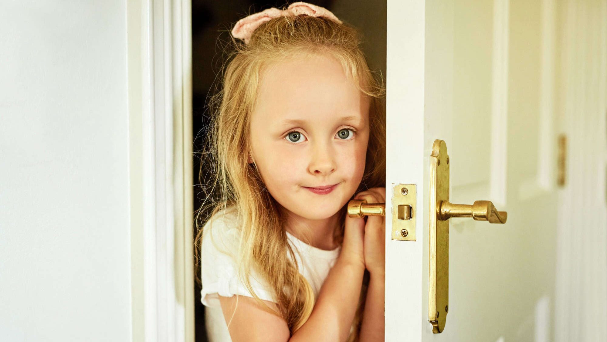 Girl opening bedroom door