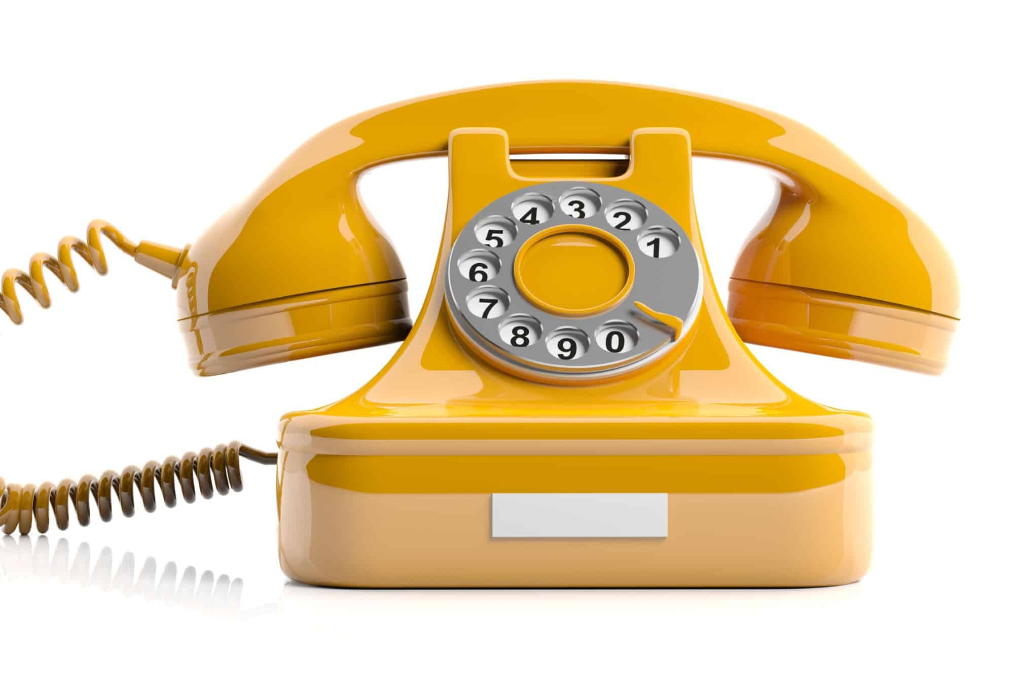 Vintage telephone. Yellow old phone isolated on white background. 3d illustration