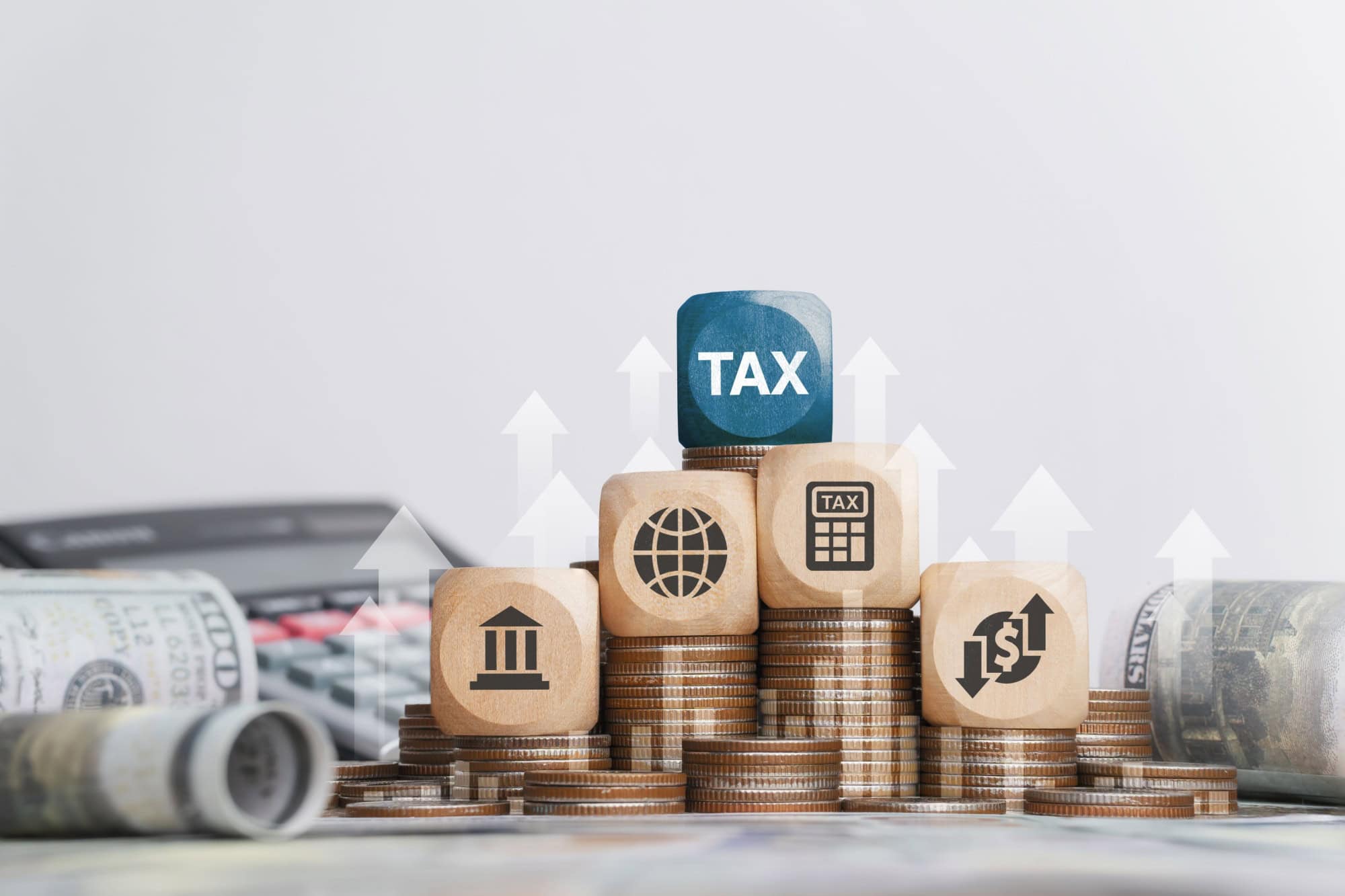 Tax concept with icons on wooden blocks Tax reduction planning, expenses, accounting, VAT and property taxes. Request a tax refund and submit taxes for online tax documents to the government.