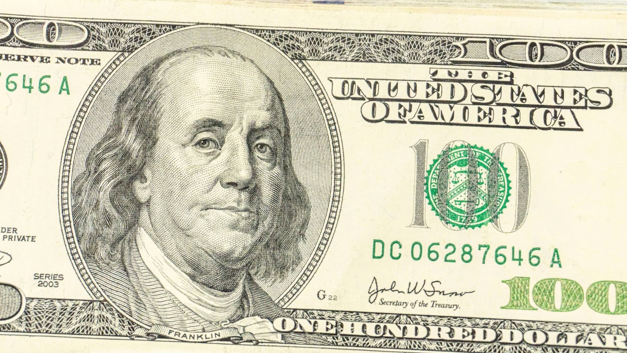 Close up view of cash money, 100 one hundred US dollar bills, 50 US dollar bills, 20 US dollar bills, lots of cash.