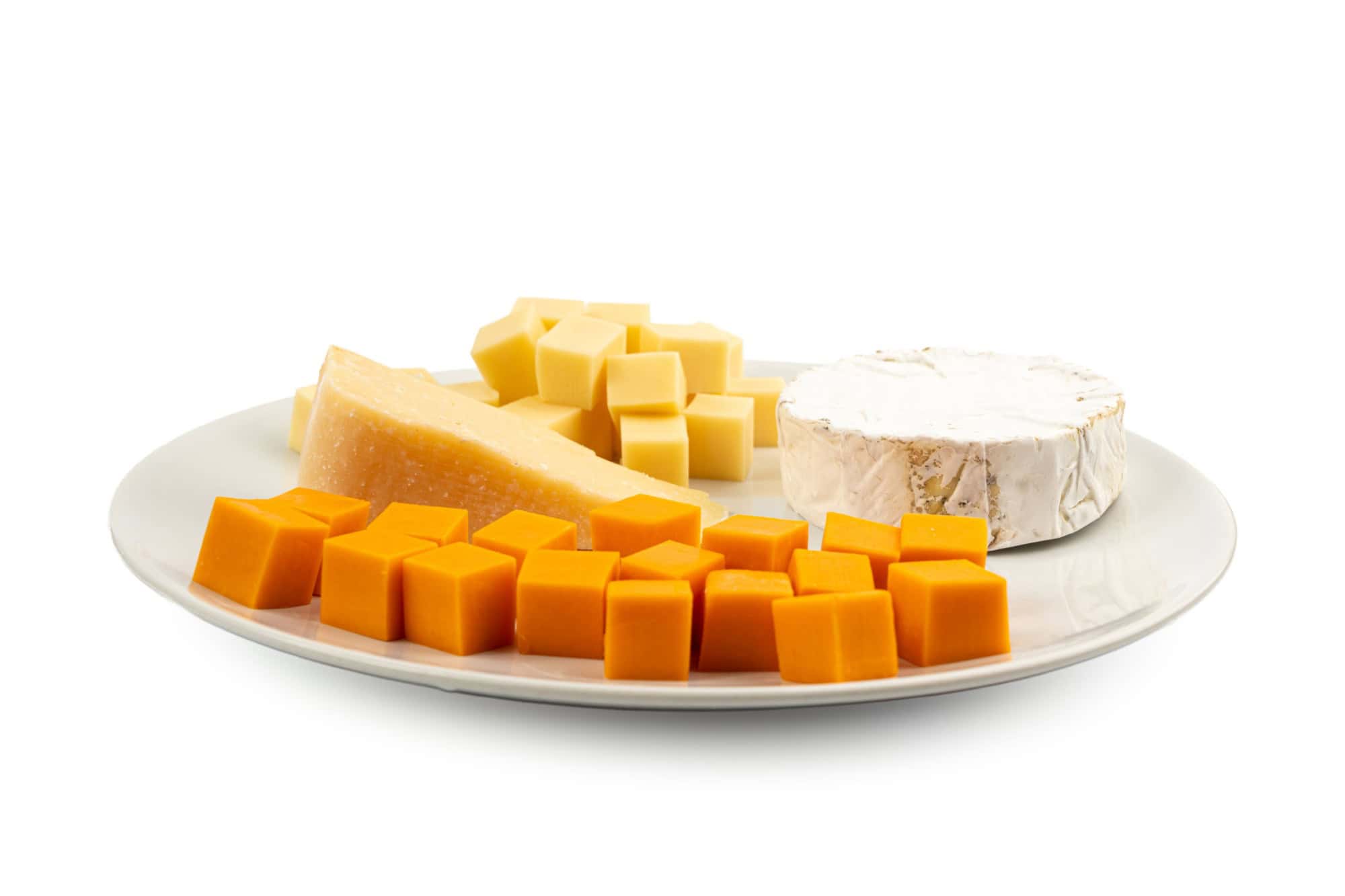 Cheese plate of color cheeses variety, yellow, white and blue gorgonzola platter, munster, fourme cheese board, assorted chopped dairy products, many stinky French cheeses on white background