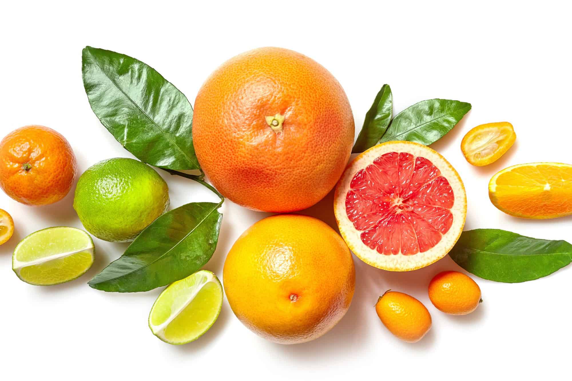 various citrus fruits isolated on white background, top view