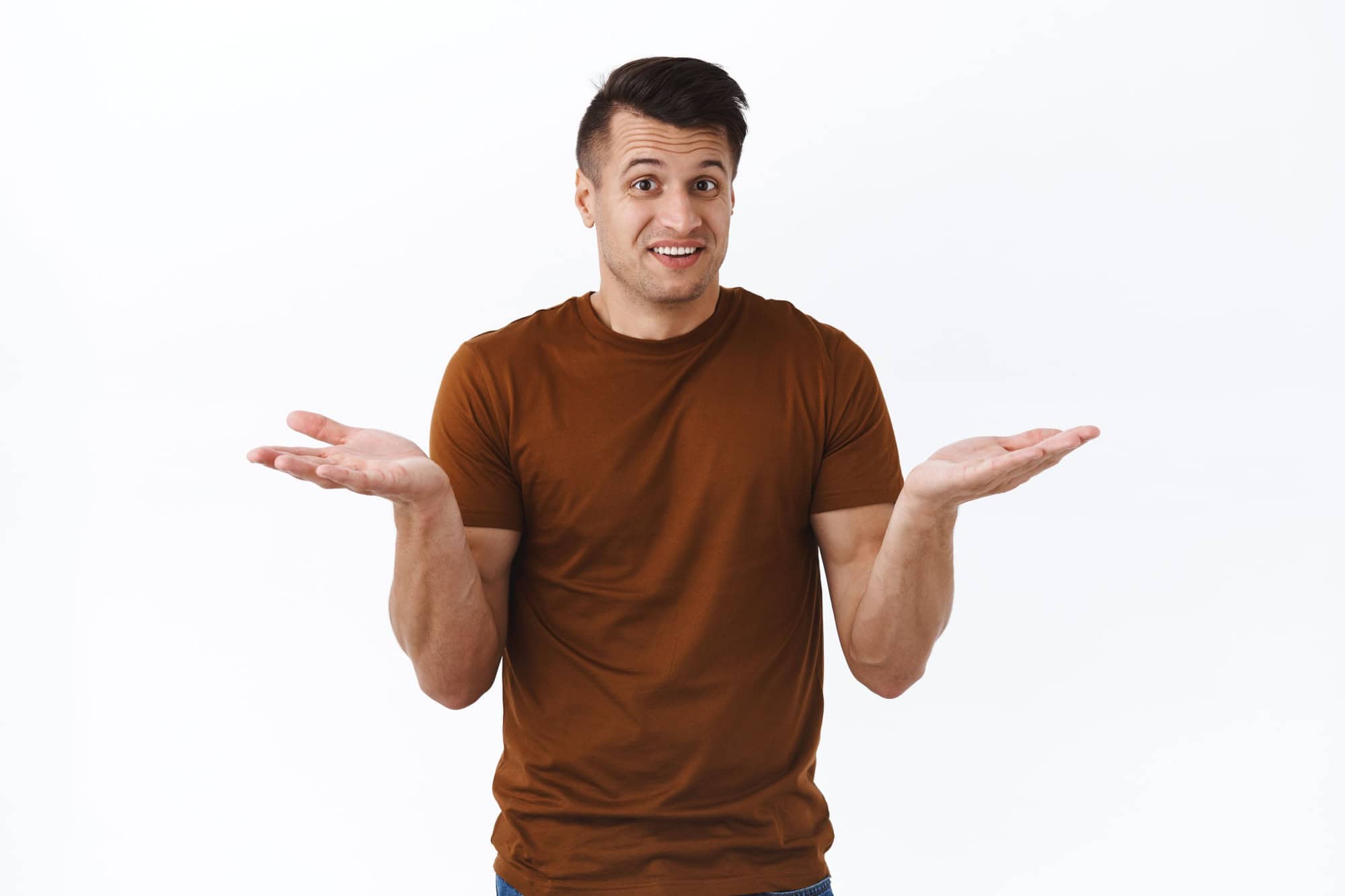 I have no idea how to help you. Portrait of handsome indecisive italian man shrugging and raise hands sideways, smiling awkward, saying sorry as cant say anything, dont know, puzzled to answer