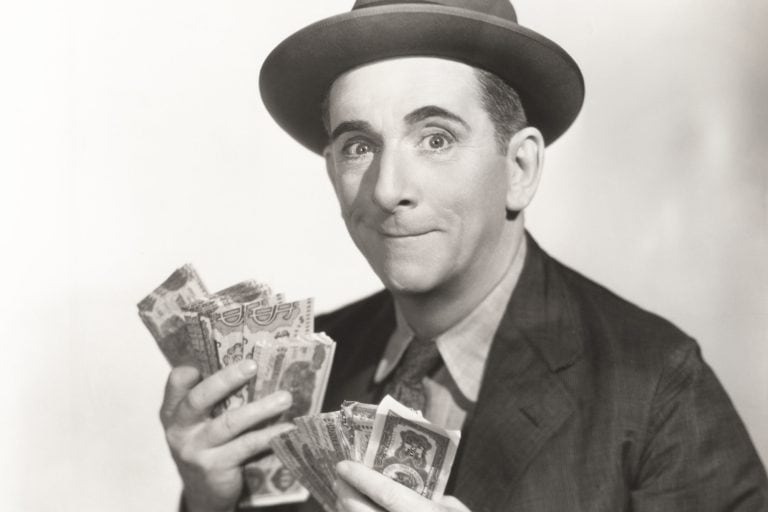 Vintage photo of many holding money