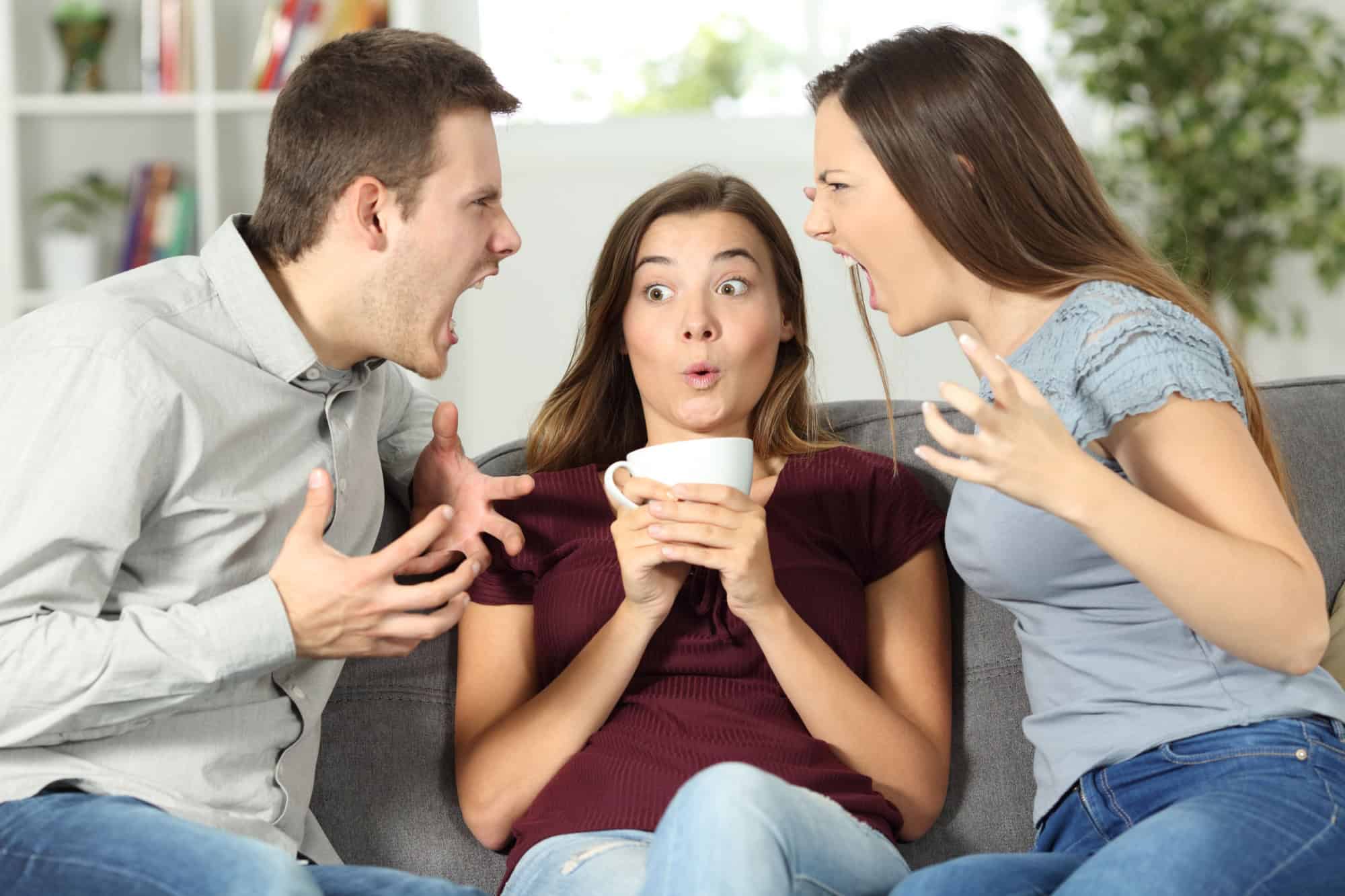Upset friend in the middle of a couple argument at home