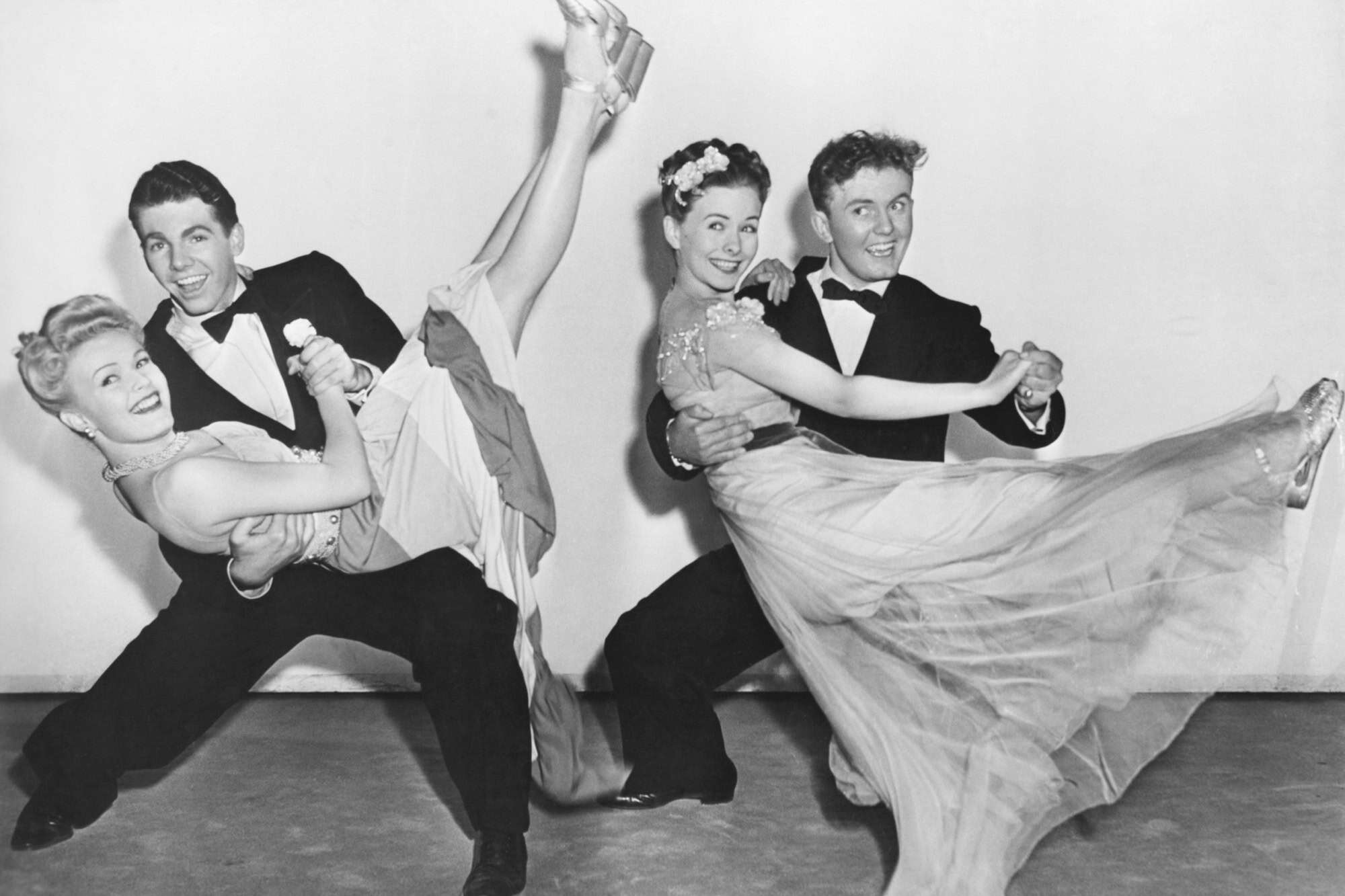 Portrait of two couples dancing
