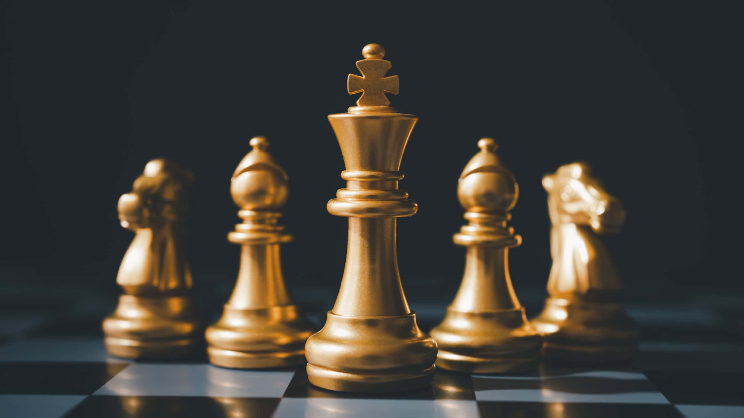 The set of golden chess pieces element is on the chalkboard.chess board game concept of business ideas and competition and stratagy plan success meaning