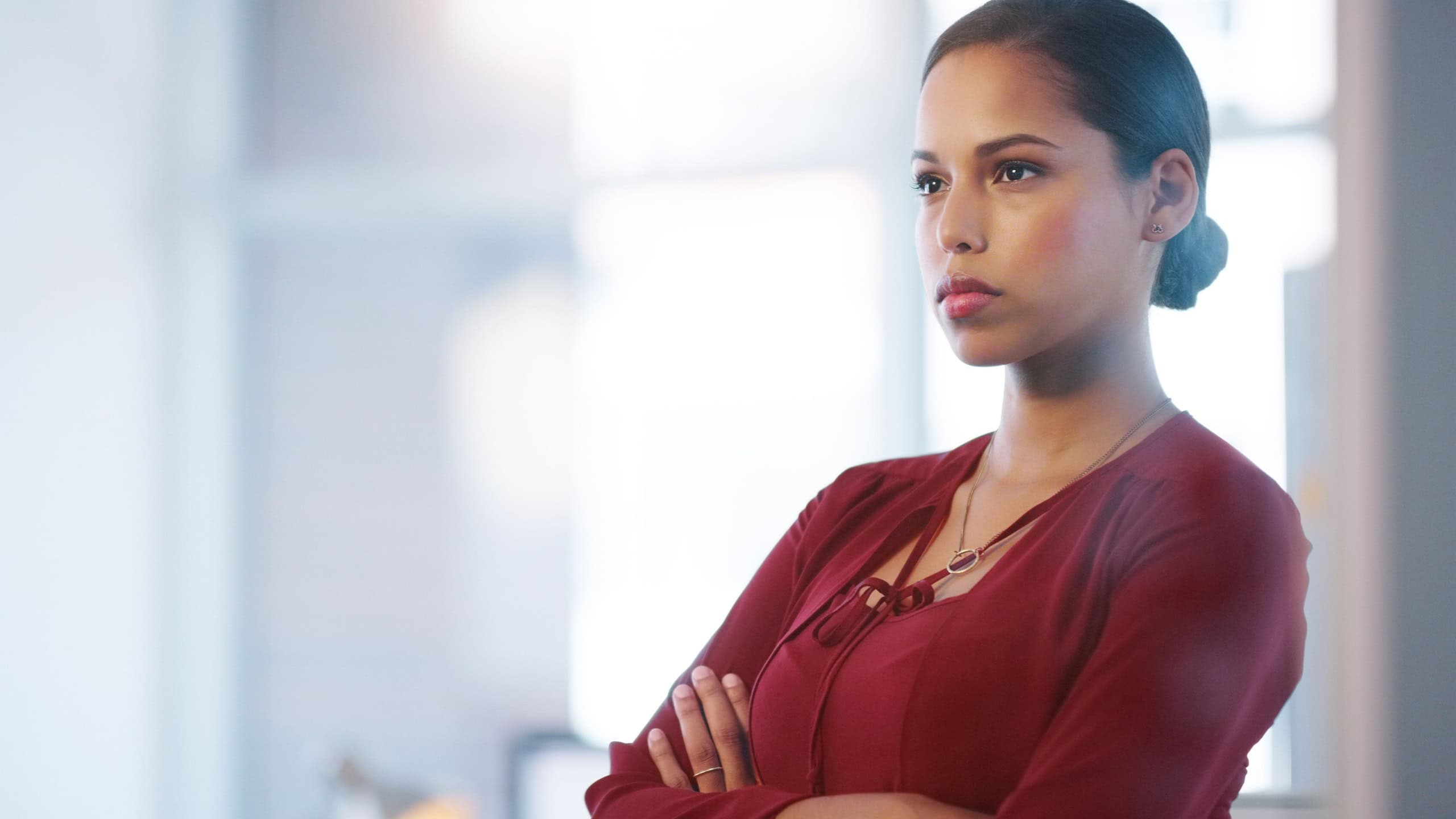 Business woman, arms crossed and anger at the office, upset or unhappy with workplace conflict. Crisis, disaster or stern employee, frustrated and serious for trouble with negative or bad mood