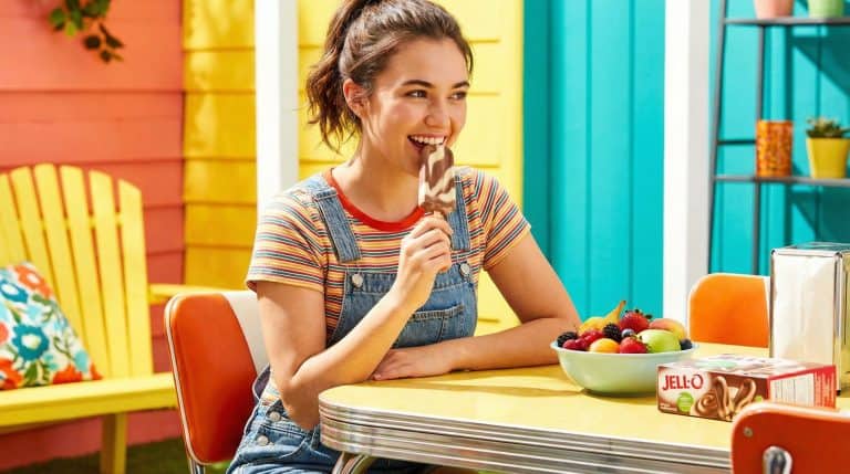 image of a young woman eating Jell-o pudding pops