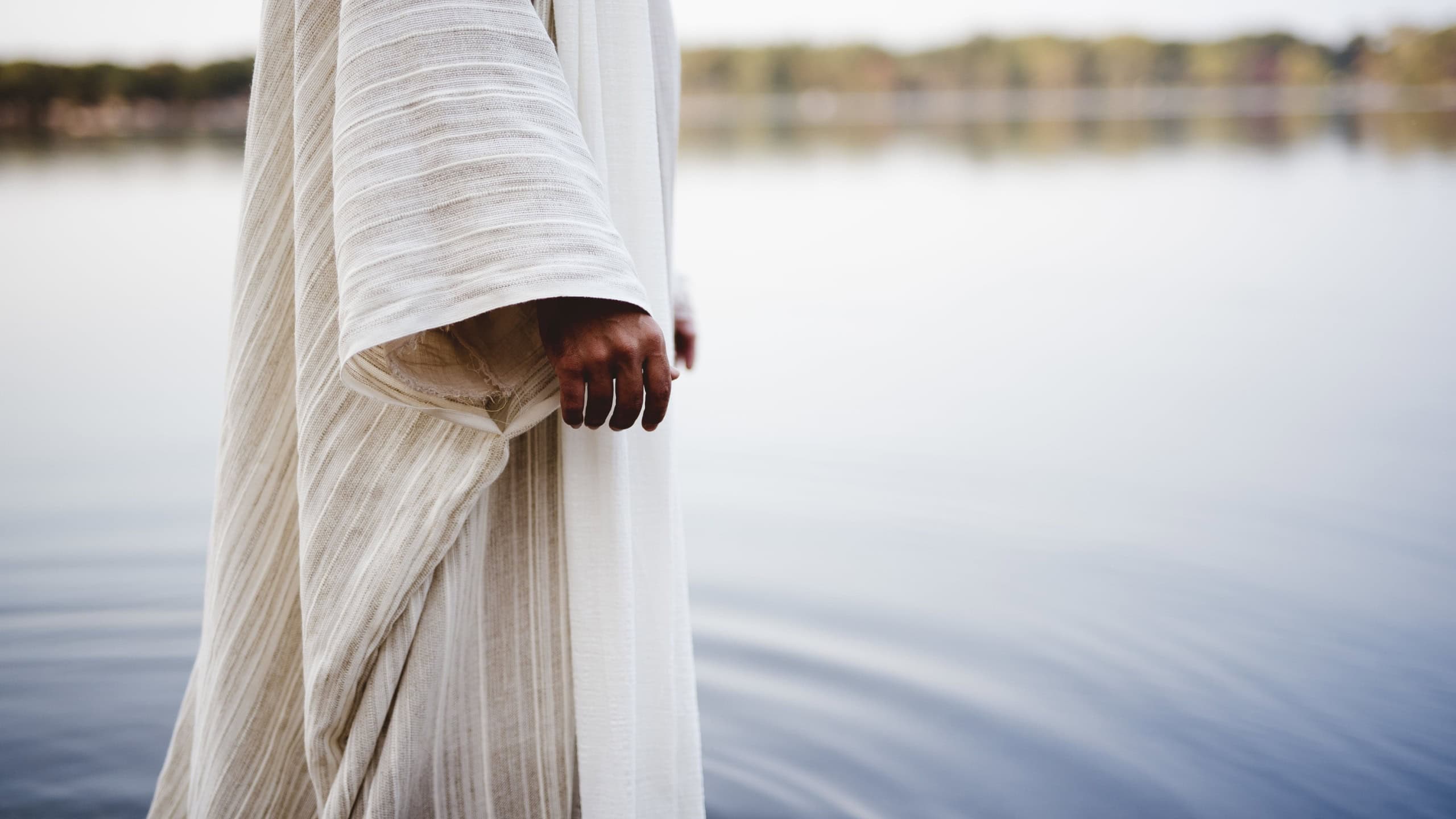A biblical scene - of Jesus Christ walking in the water with a blurred background