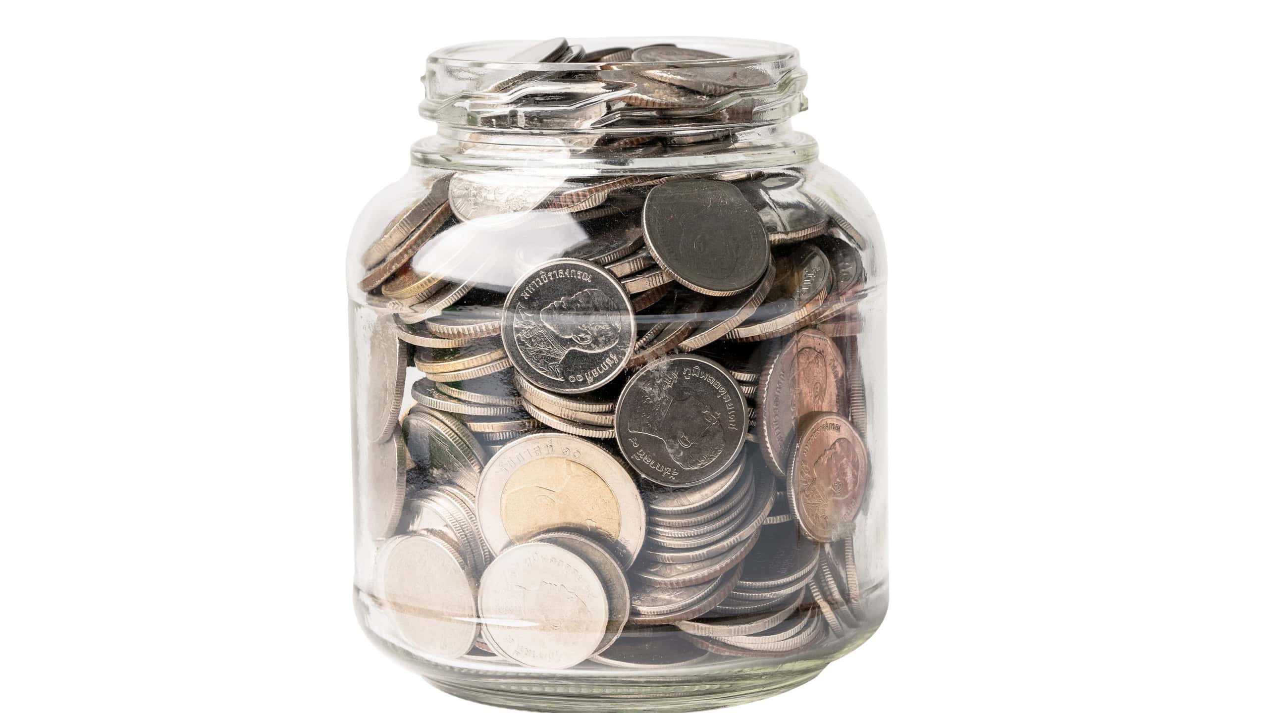 Save money coins in grass jar, Business finance investment concept.