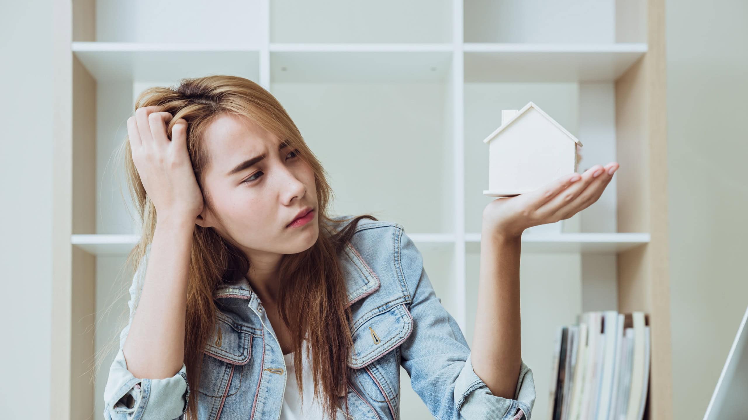 Young women teen in business office looking at home serious stress moody worry about house expense