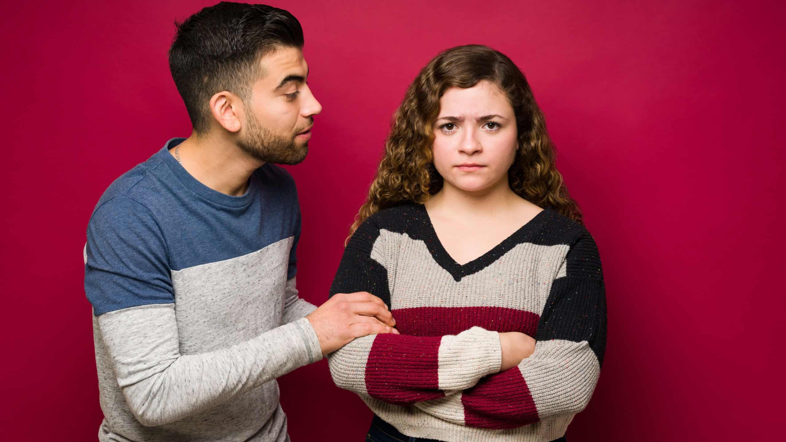 Don't talk to me. Upset young woman feeling angry with her boyfriend. Sad young man apologizing and saying sorry