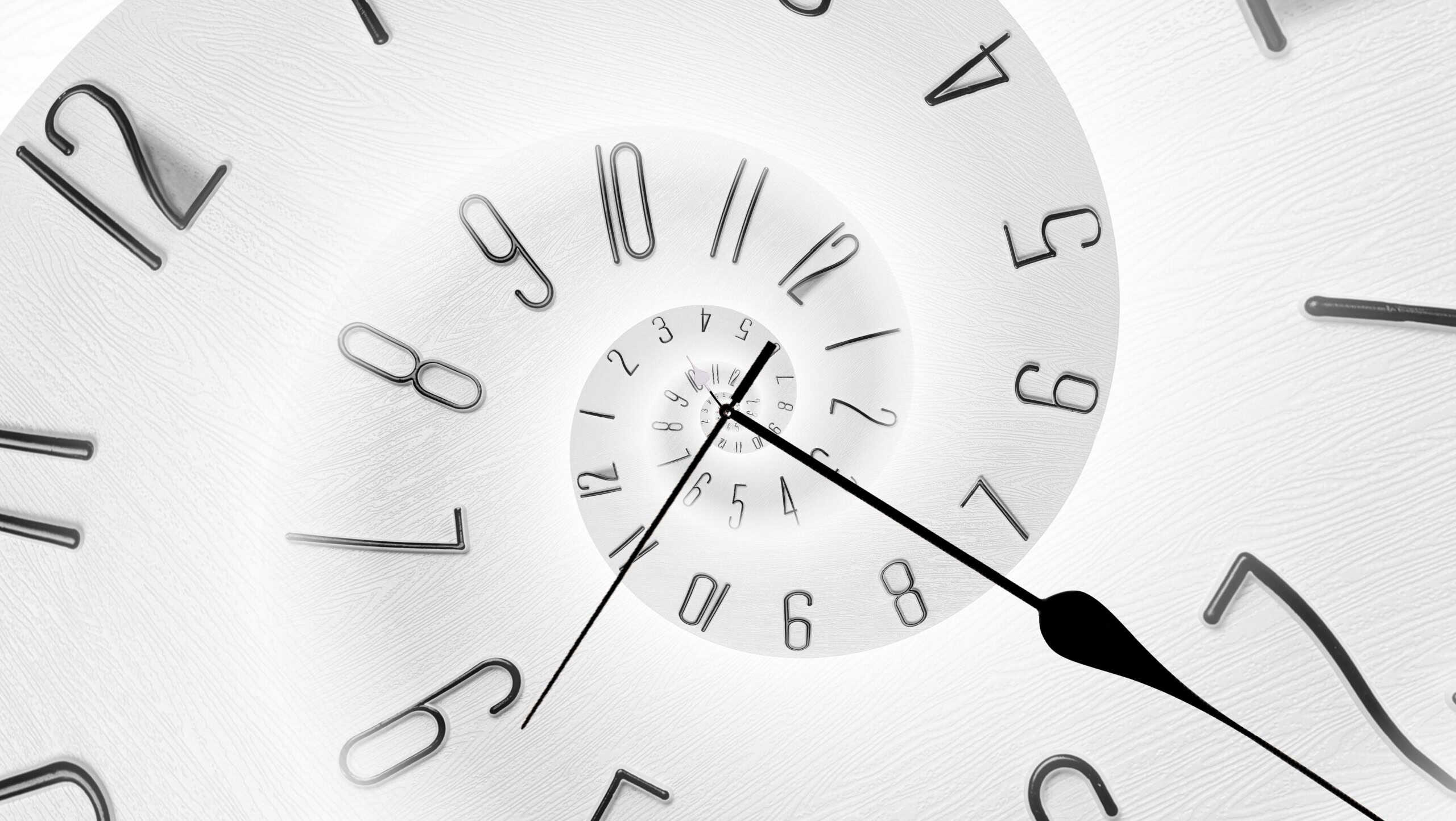Infinity and other time related concepts. White clock face twisted in spiral, fractal pattern