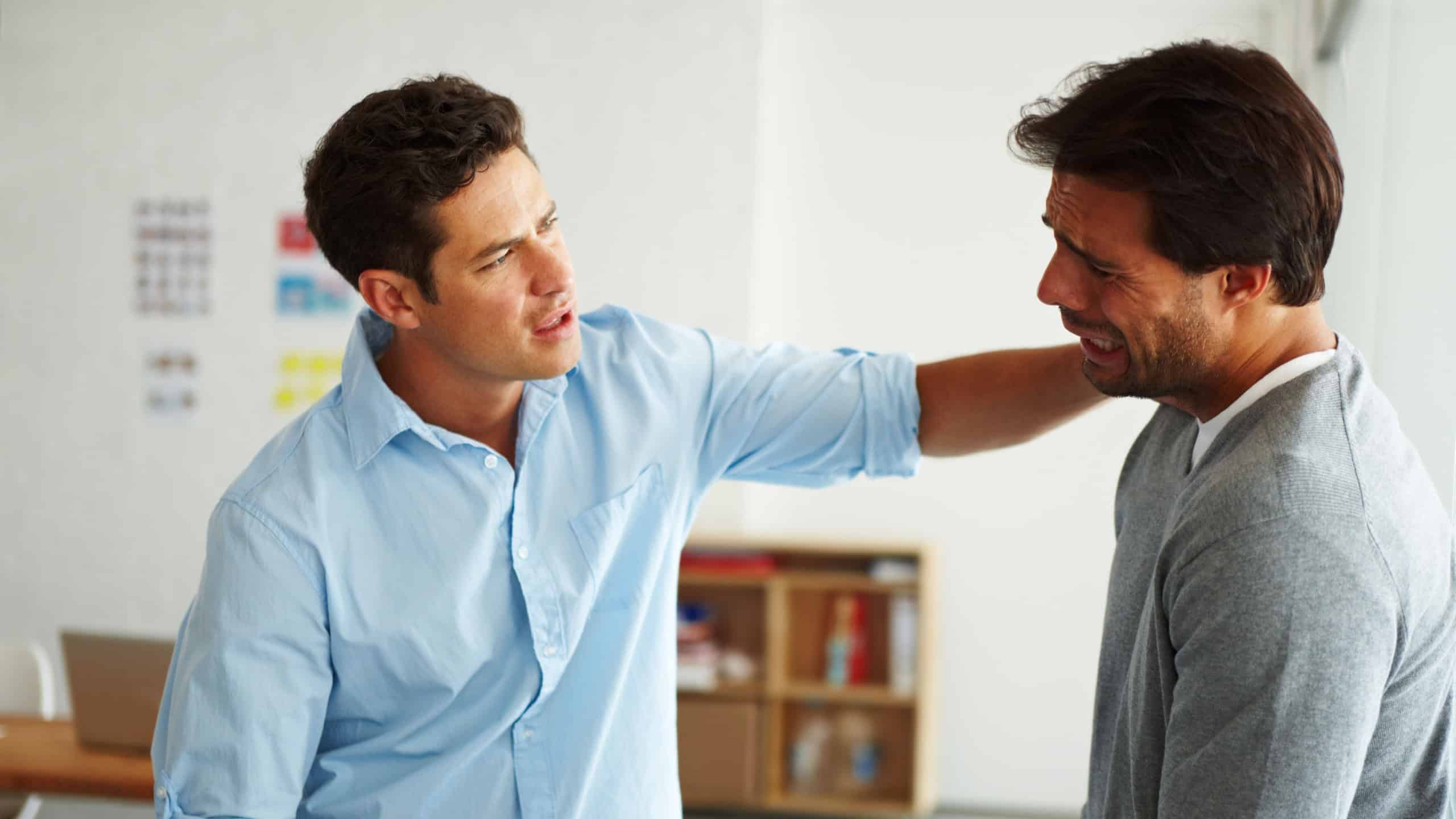 Men, console and crying in office with support, sad and listening for mental health at creative agency. Business people, friends and comfort with care, frustrated and depression at startup in Spain