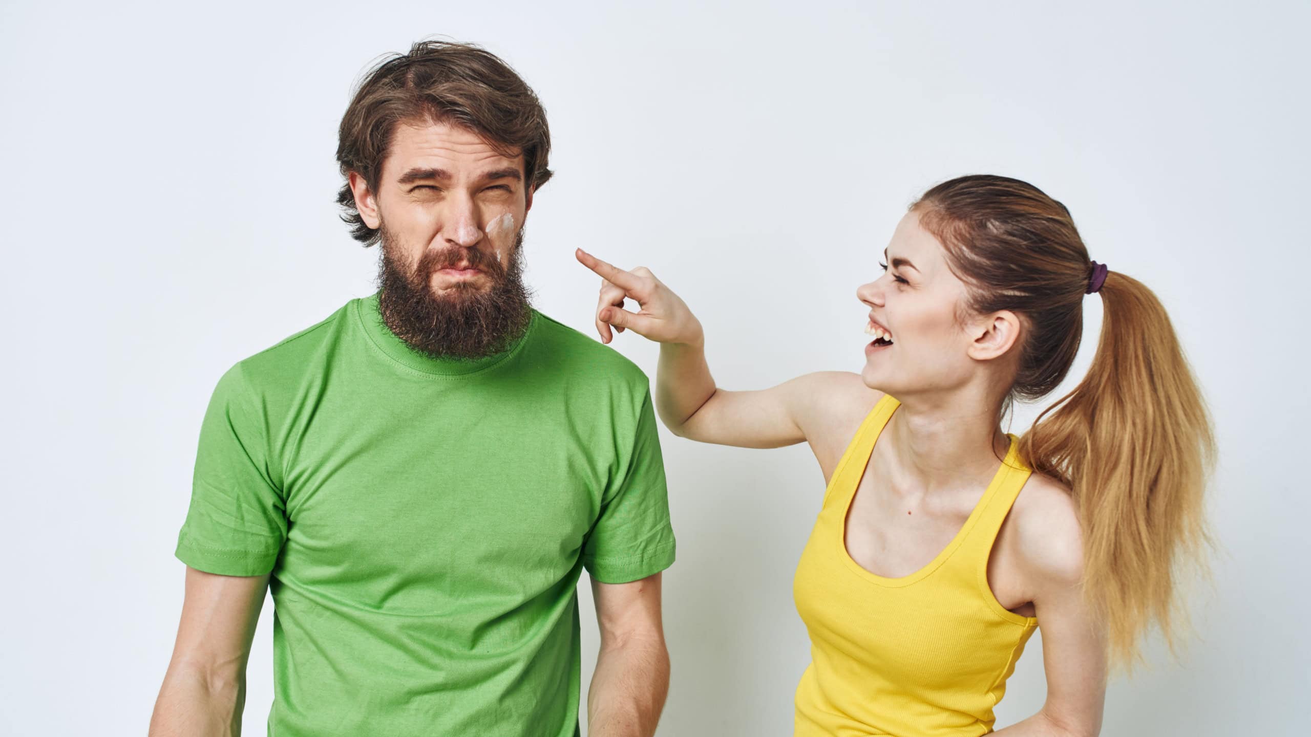 Woman laughing at man