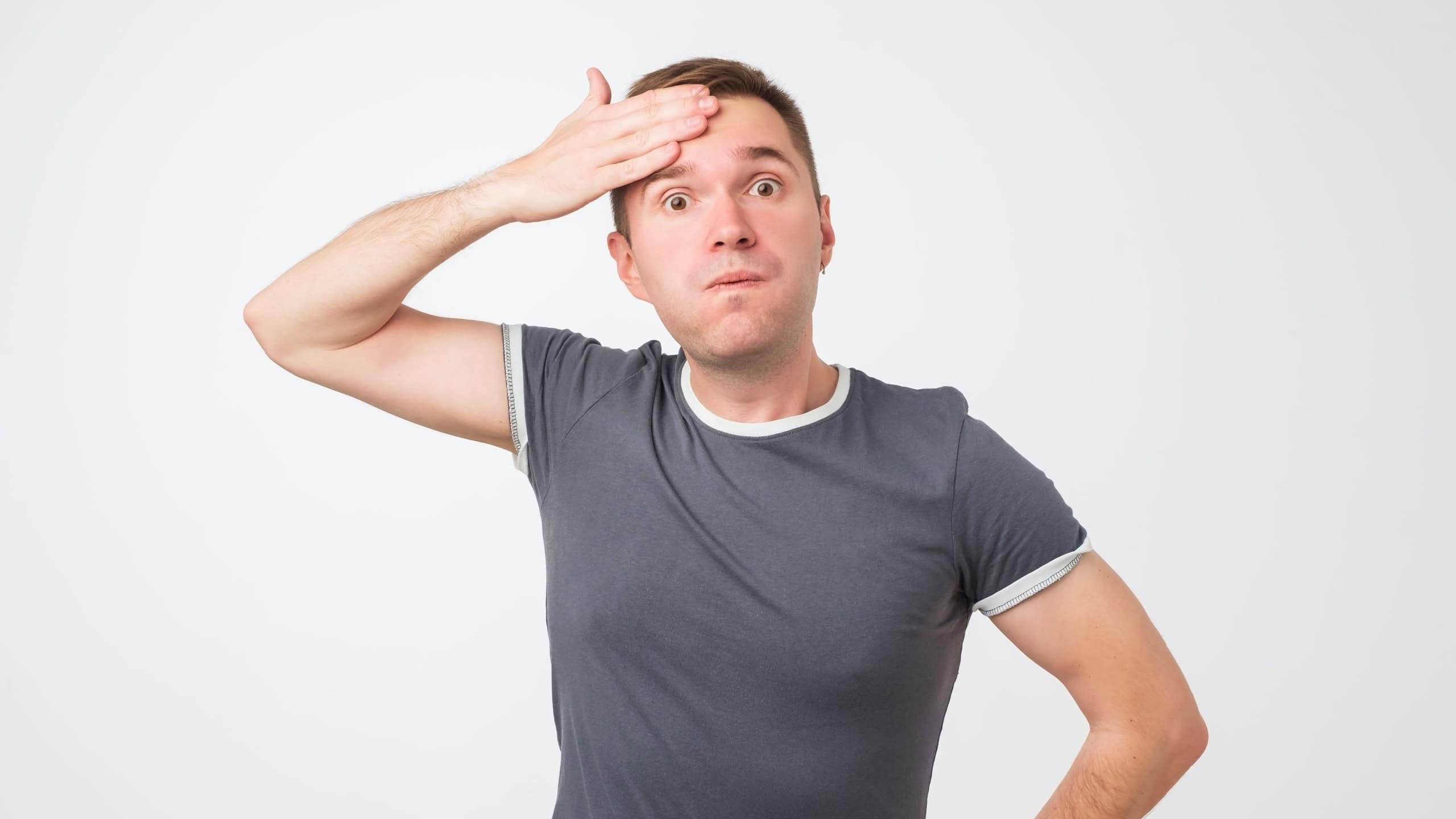 Exhausted european man wipes the sweat of his forehead. He has finished his work