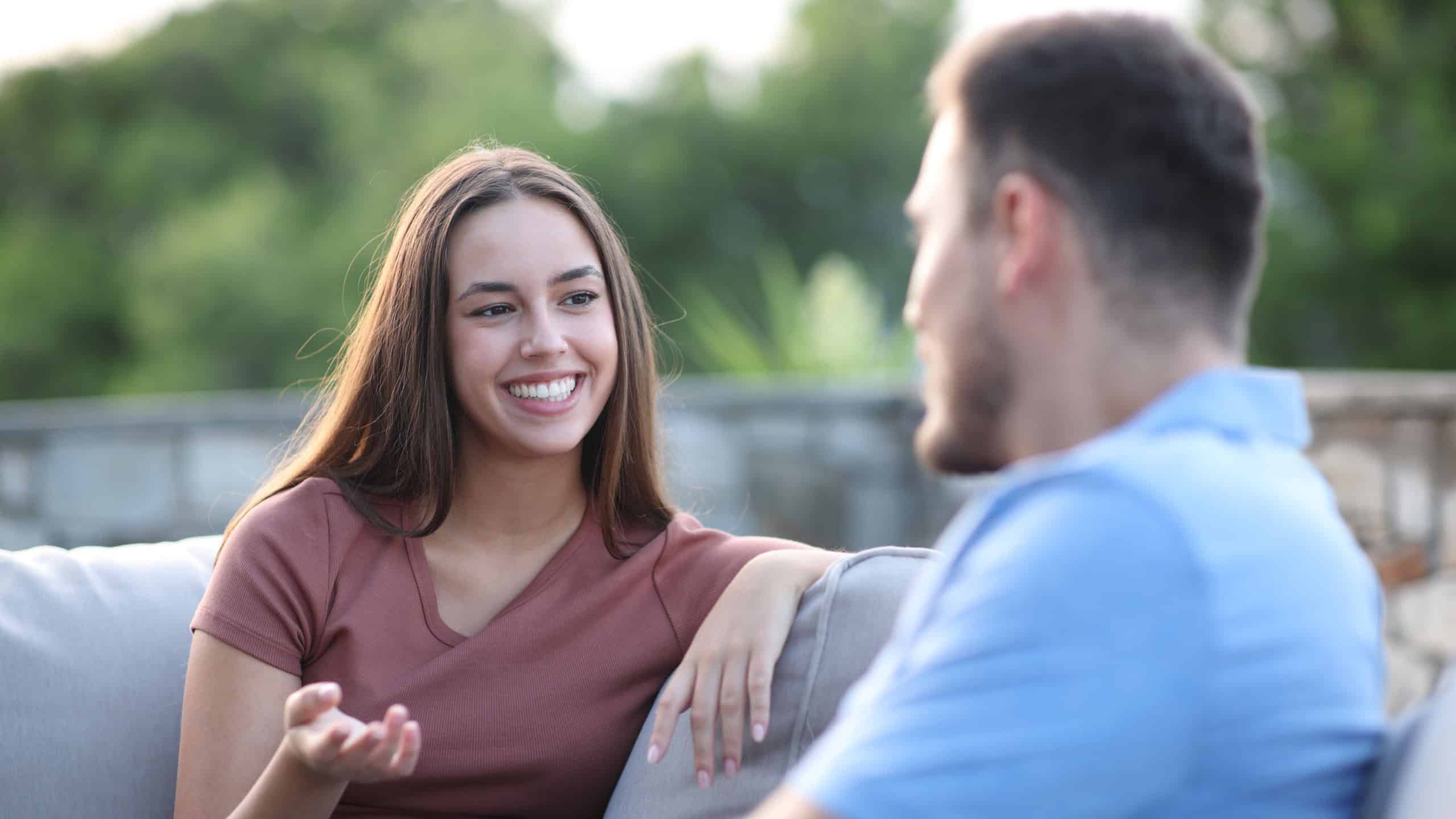Man and woman talking in a terrace at home