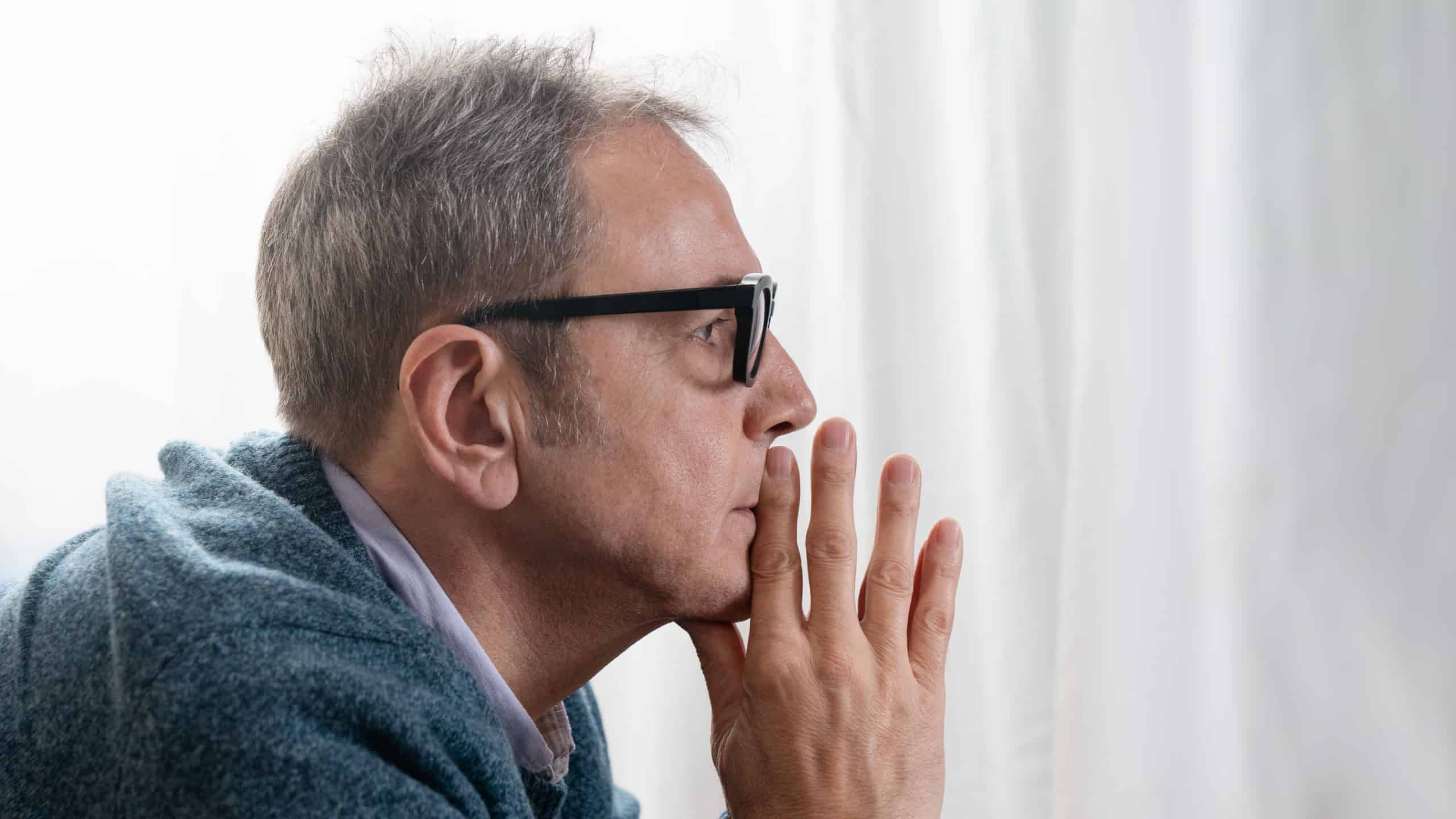 Portrait of a serious senior man with a pensive and contemplative expression, deep in thought. Mature businessman or CEO staring ahead, contemplating a difficult decision.