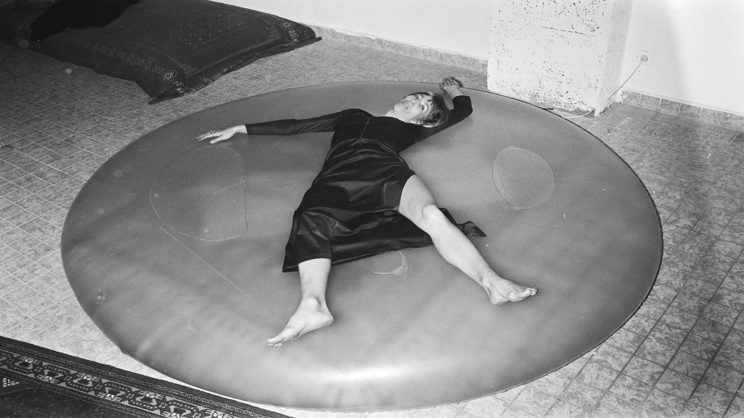 Woman lying on waterbed