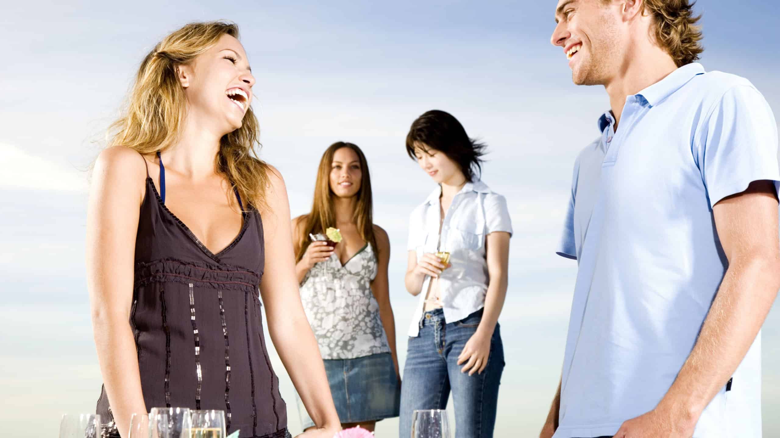 Young couple talking at a party