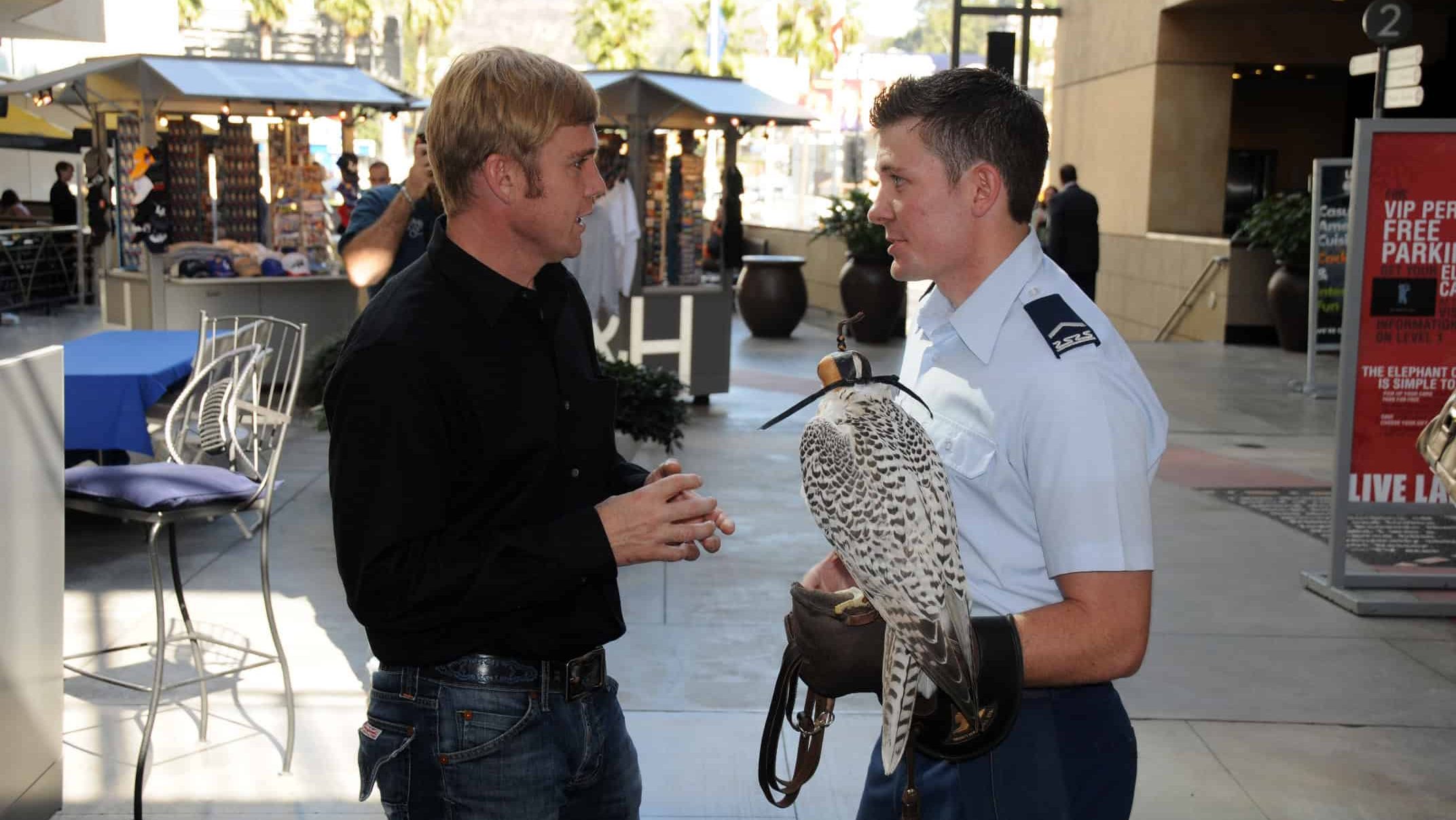 Actor Rick Schroder and Air Force Academy Cadet 3rd Class Jeremiah Baxter, holding falcon named Banshee