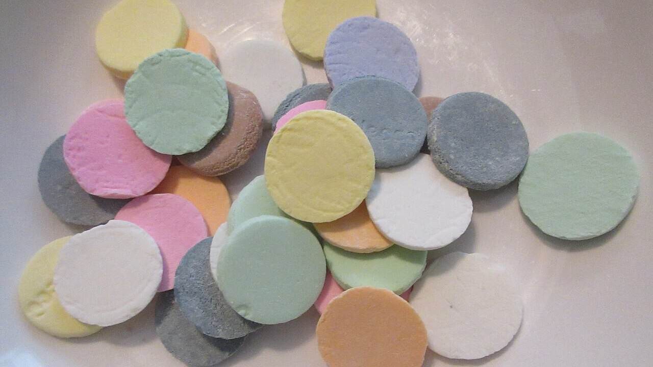 Contents of a roll of Necco Wafers emptied into a shallow bowl