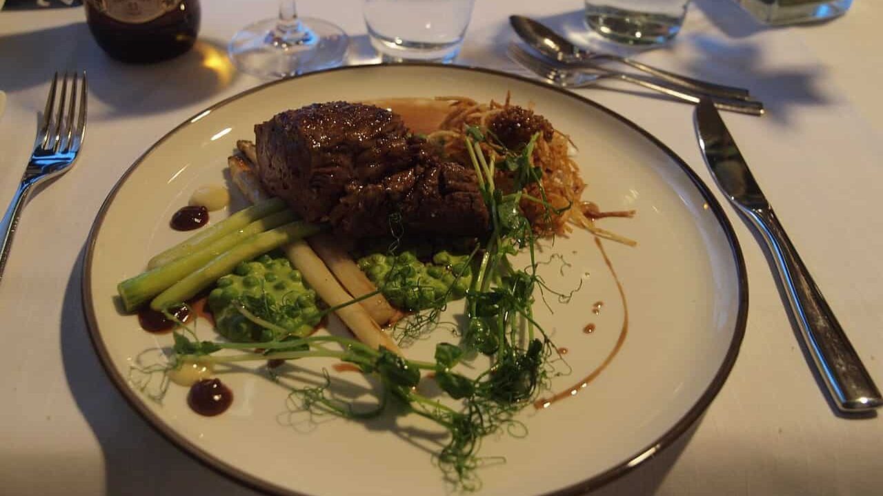 The main course of the Oscar menu in the Oscar à la Carte restaurant on Viking Grace in March 2016: Grilled veal fillet and sweetbread, pea purée, aioli and mustard seed seasoned potato