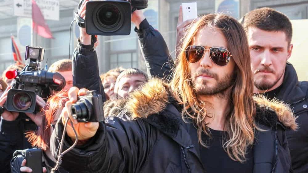 KIEV, UKRAINE - MARCH 13, 2014: Jared Leto surrounded by a crowd of Ukrainian fans and journalists taking pictures on the Maidan Nezalezhnosti (Independence Square) during the times of Euromaidan