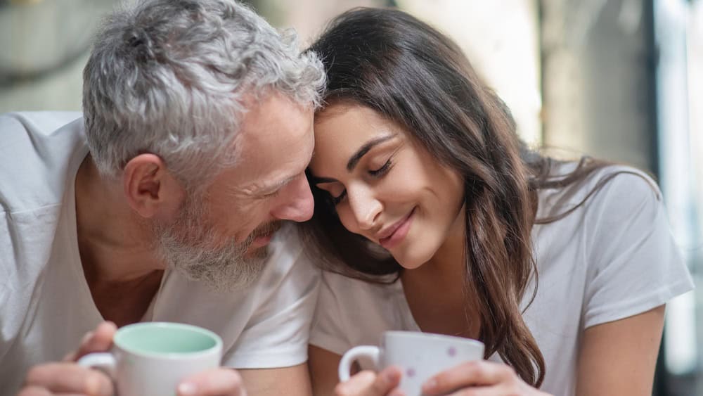 Enjoying tenderness. A lovely couple having their mornng coffee together