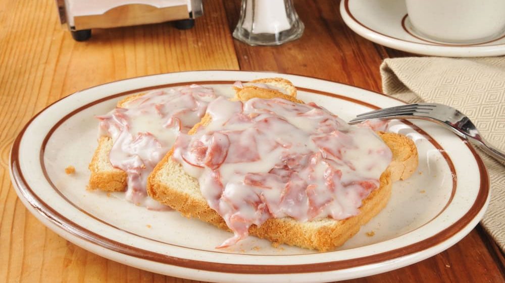 Creamed chipped beef on toast with a cup of coffee or tea