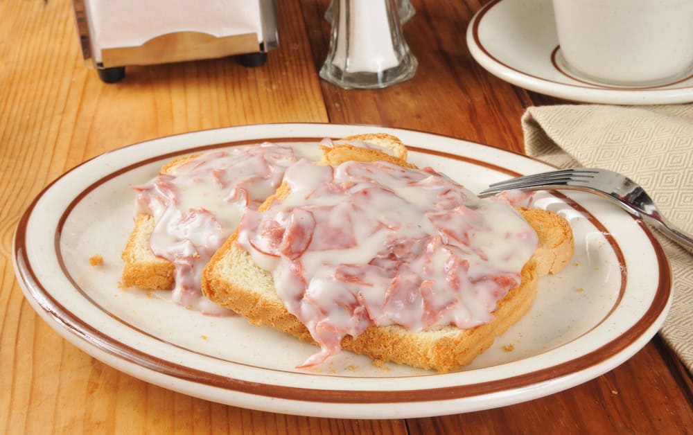 Creamed chipped beef on toast with a cup of coffee or tea