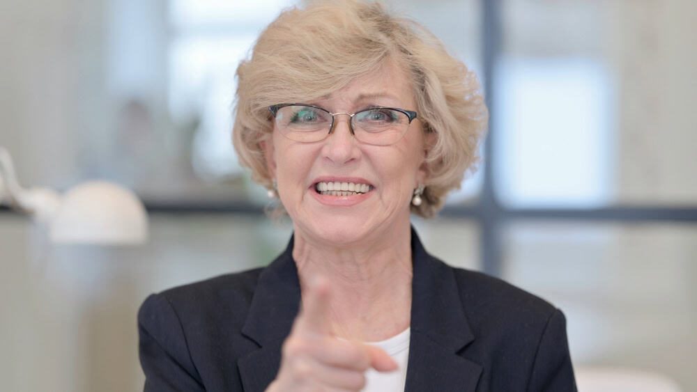 Angry Old Businesswoman Arguing at Work