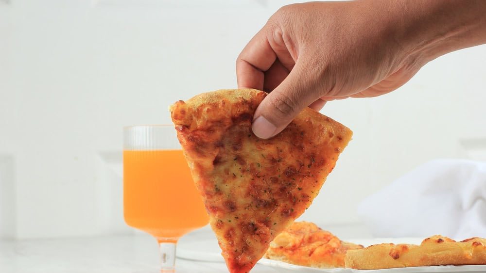 Man's Hand Dip Pizza to Chilli Sauce, Concept Menu Book for Pizza Store