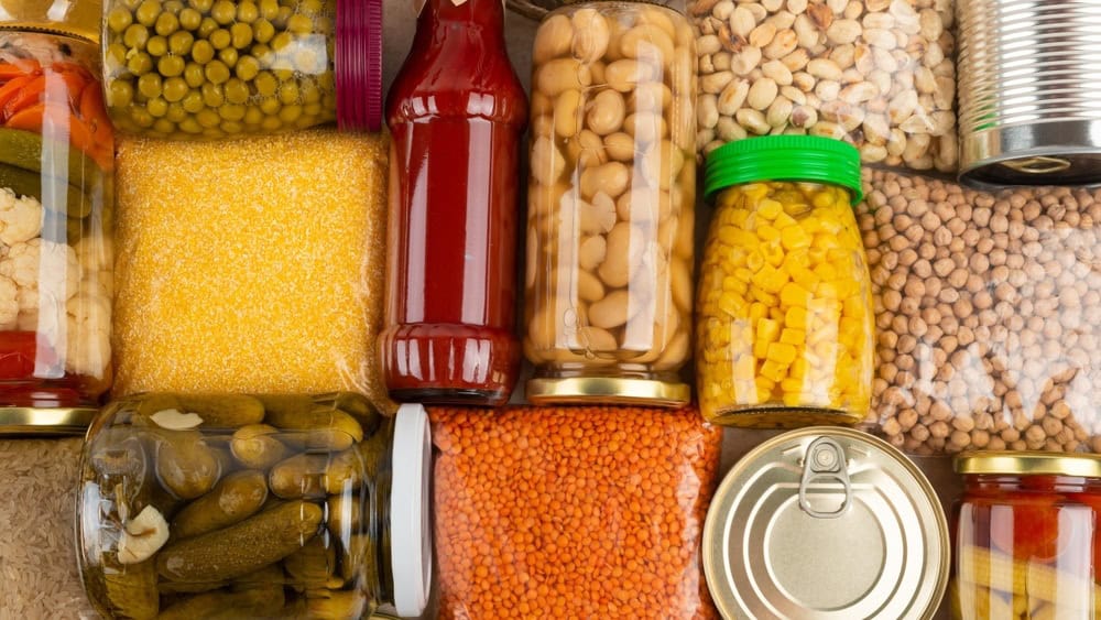 Emergency survival groceries on kitchen table closeup flat lay
