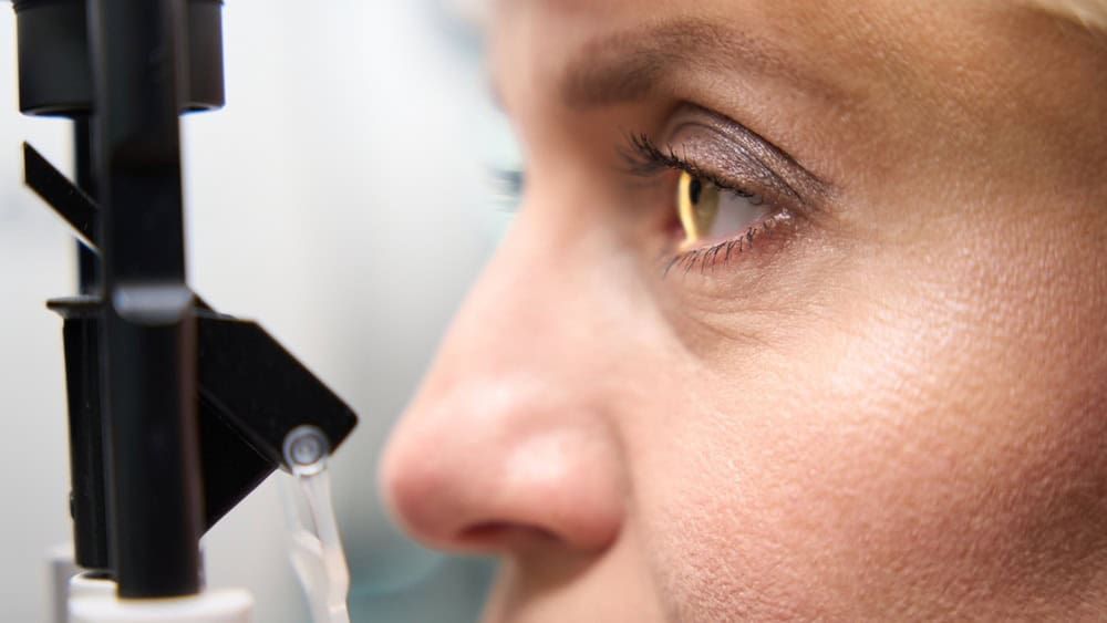 Middle-aged lady undergoing an ophthalmological examination