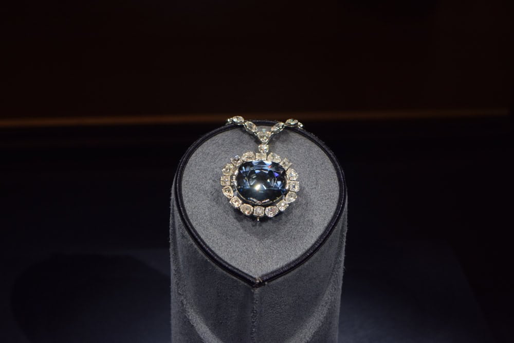 A stunning Hope Diamond set against a dark background