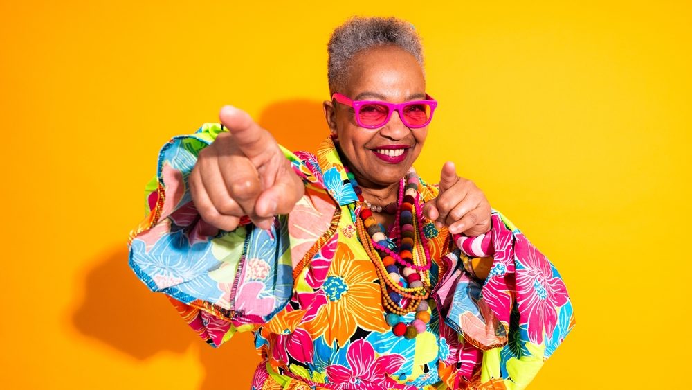 Colorful portrait of funny senior black woman wearing stylish clothing isolated in studio - Cool modern old female adult, concepts about elderly, senior people and body positive