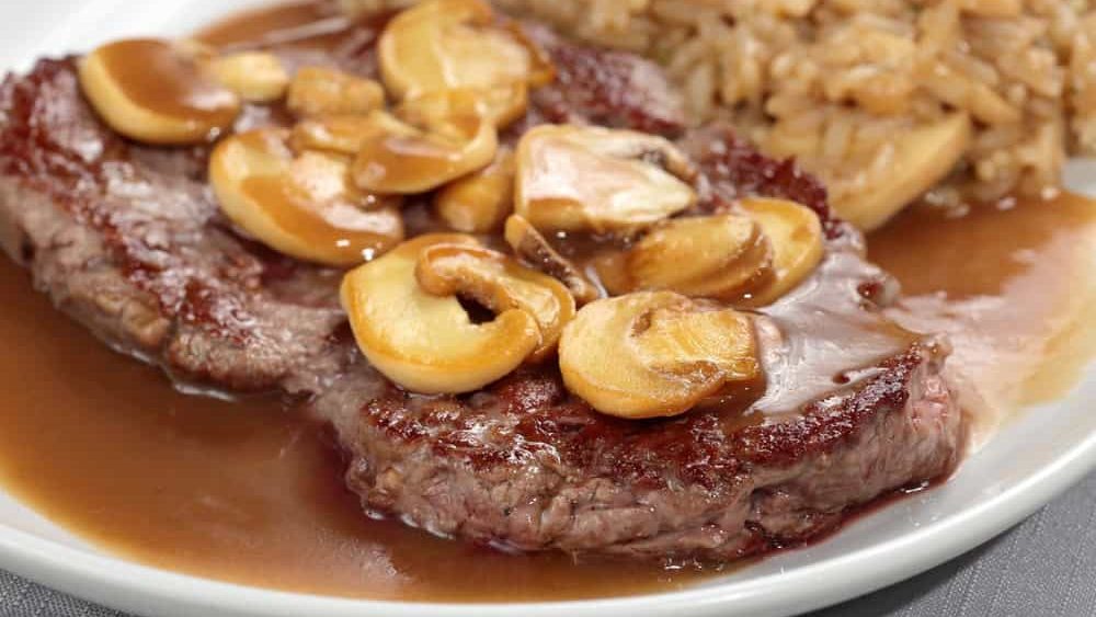 Steak à Diana with risotto on the plate