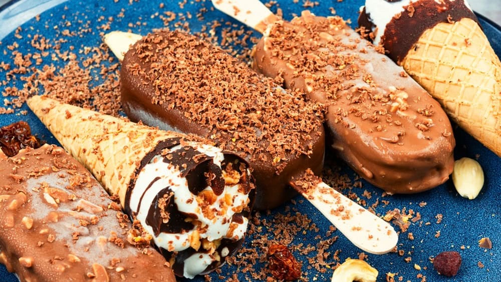 Delicious glazed ice cream bars with nuts.