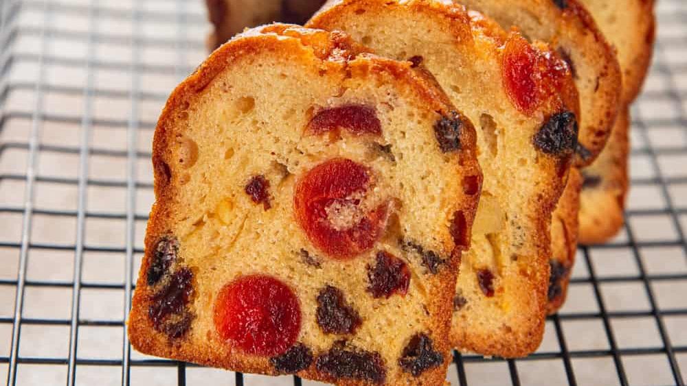 Fruit cake dessert sweet dried fruit traditional pastry, nuts meal food snack on the table copy space food background rustic top view