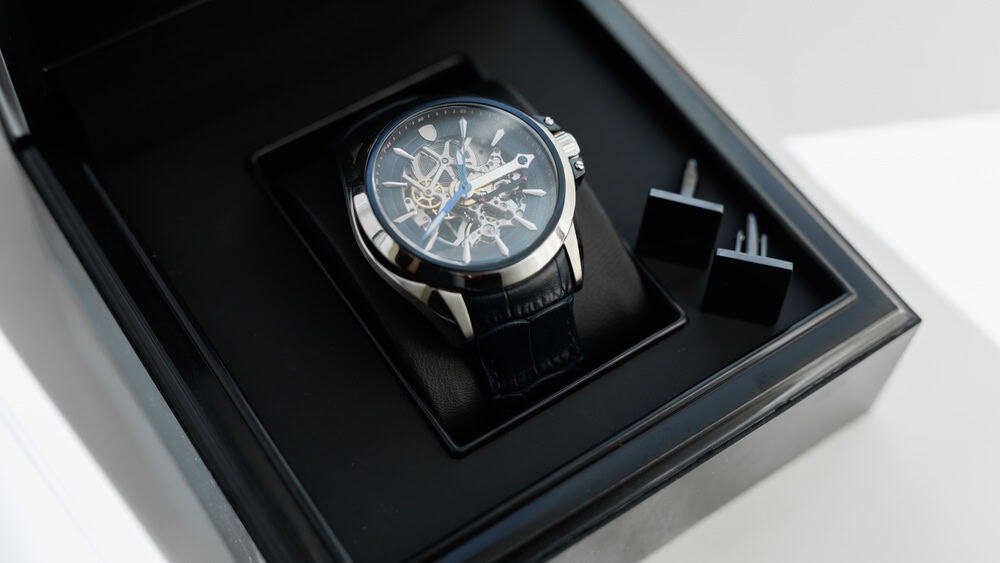 Luxury men's wristwatch displayed and packaged in a box